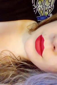 a girl laying on the bed her breasts unsheathed